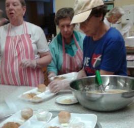 Volunteers Preparing Food to Serve